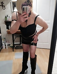 Lucy, a transgender woman with a large penis, showcases her dominatrix fashion in a shiny dress - A collection of 18 images on xHamster
