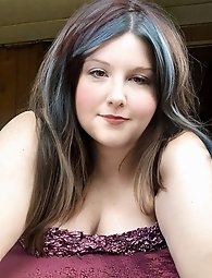 Pretty transsexual woman exposes her breasts.