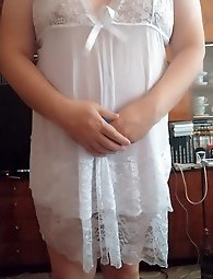 A businesswoman in a white blouse and black skirt captures provocative poses