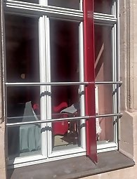 I m sitting in the window of the red light district