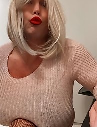 Transgender women in lingerie pose partially nude outdoors