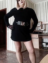 A blonde transgender woman is masturbating.